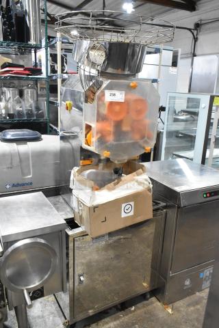 JuiceMatic MJ40 commercial citrus juicer, stainless steel, automatic feed, on casters, 115V, floor model. Excellent condition.