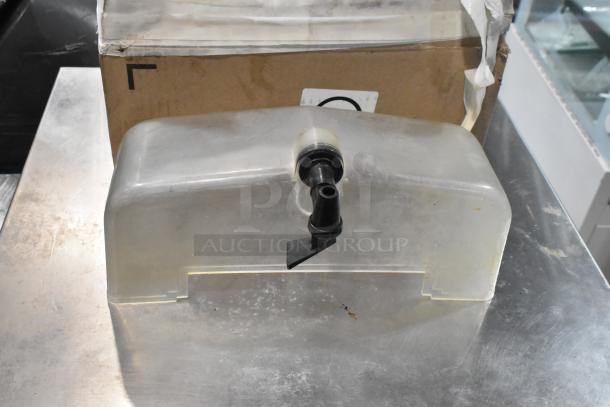 JuiceMatic MJ40 commercial citrus juicer, stainless steel, automatic feed, on casters, 115V, 1 Phase, used condition.