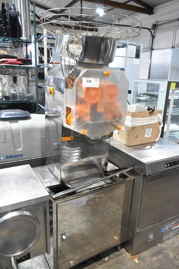 JuiceMatic MJ40 stainless steel commercial citrus juicer on casters, automatic feed, 115V, visible label with "238".