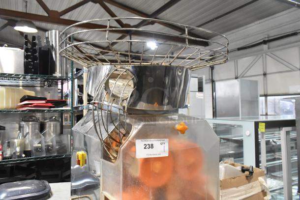 JuiceMatic MJ40 stainless steel commercial citrus juicer, automatic feed, on casters, for 115 volts, 1 phase use.