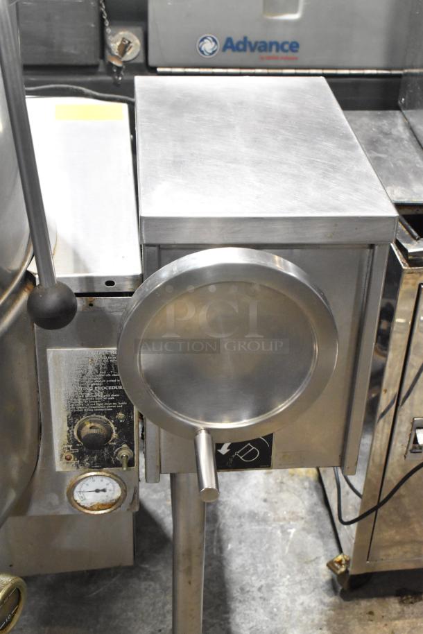 Cleveland KGL-60T stainless steel 60-quart steam kettle, used condition, visible control panel and spout, ideal for commercial use.