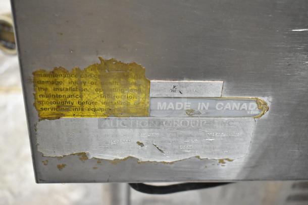 Cleveland KGL-60T stainless steel steam kettle, 60 quart, floor style, "Made in Canada" label. Visible wear on markings.