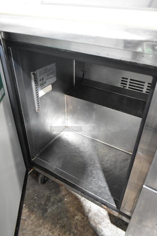 Turbo Air TST-48SD-D2 stainless steel commercial sandwich salad prep table, visible interior, on commercial casters.