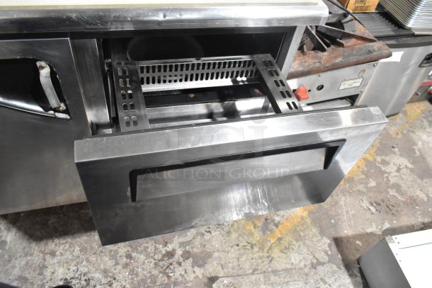 Turbo Air TST-48SD-D2 stainless steel prep table with open drawer, shown on commercial casters, 115V, 1 phase.