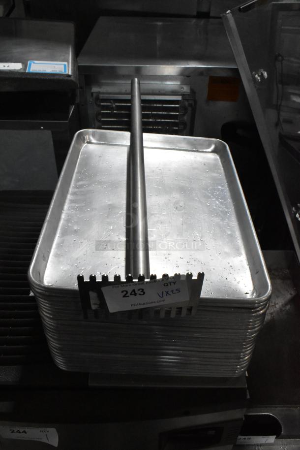 Stack of metal baking pans with a metal rod, labeled "243, QTY 25," auction item featuring 25 times bid multiplier.