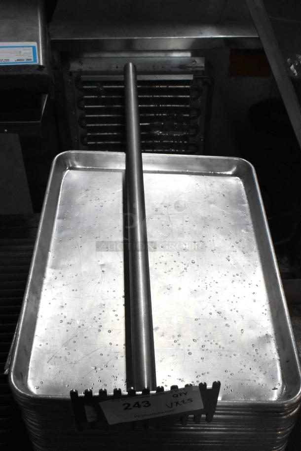 Metal baking pans with a rod; visible tag "243, Qty 25." Slight wear, suitable for commercial or home use.