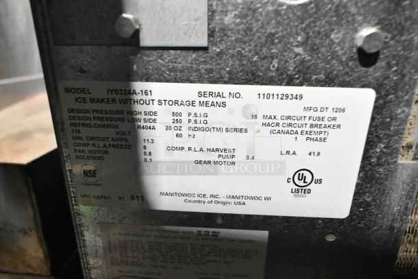 Manitowoc IY0324A-161 stainless steel commercial ice machine head, 115 volts, with model and specifications label visible.