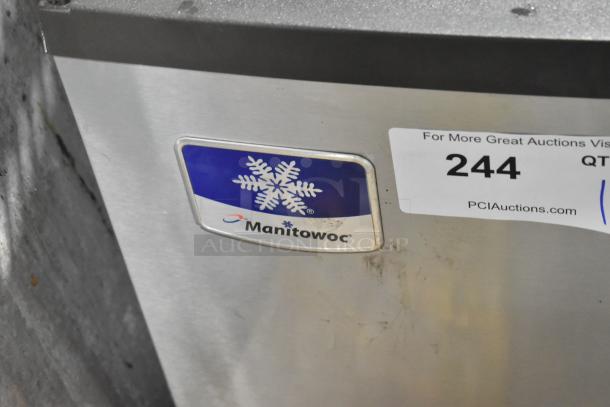 Manitowoc IY0324A-161 stainless steel ice machine head, 115 volts, 1 phase. Features company logo and auction sticker.