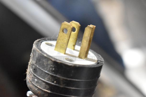 Close-up of a power plug for the Cecilware Stainless Steel Commercial Countertop Electric Powered Flat Top Griddle.