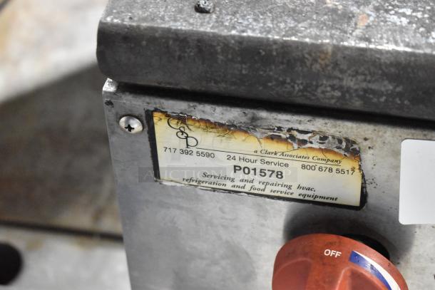 Cooking Performance Group CPGSP-18-2-N stock pot range, stainless steel, visible wear, service label with contact info.