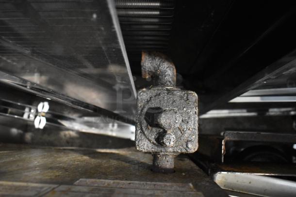 Cooking Performance Group stainless steel stock pot range, model CPGSP-18-2-N, shows signs of heavy use.