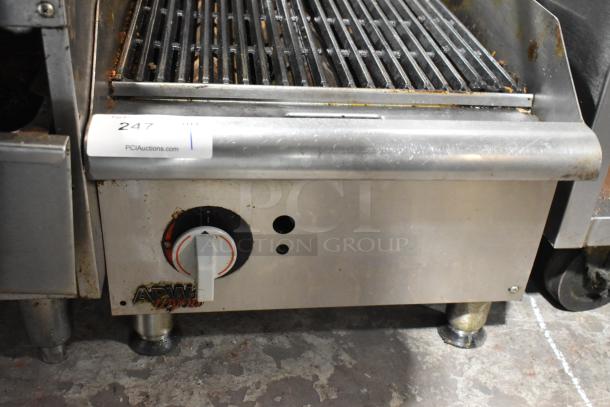 APW Wyott stainless steel gas charbroiler grill, used condition, countertop model with control dial and visible branding.