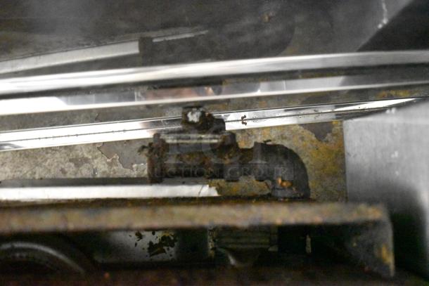 APW Wyott stainless steel commercial gas charbroiler grill, showing wear and rust, essential for countertop cooking.