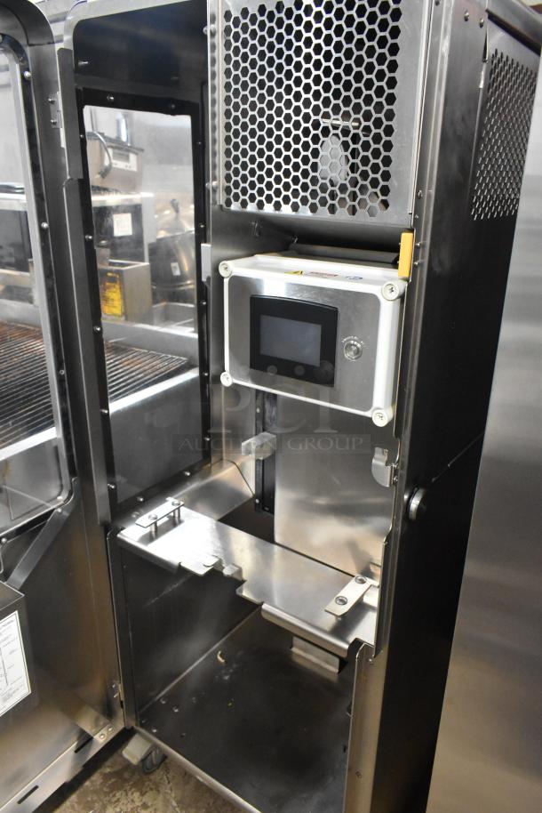 Stainless steel JBT 2ND-GEN-MFJ-HE citrus juicer on casters, floor model with digital display, commercial-grade, 120V, 1-phase.