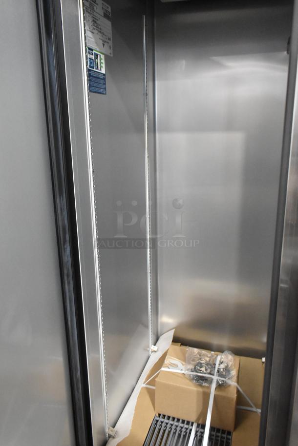 Brand new True T-35-HC stainless steel commercial 2 door cooler interior with poly coated racks, tags visible. 115V, 1 Phase.