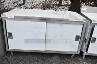 Steelton 522EBT3060D 30" x 60" stainless steel table, enclosed base, sliding doors, midshelf, scratch and dent condition.