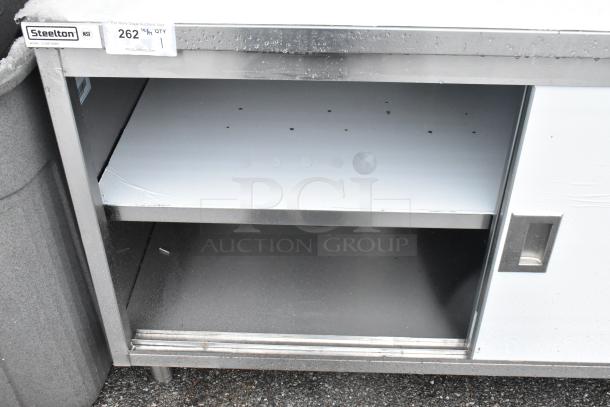 Steelton 522EBT3060D 30"x60" enclosed base table, 18-gauge Type 430 stainless steel, sliding doors, midshelf, scratch and dent.