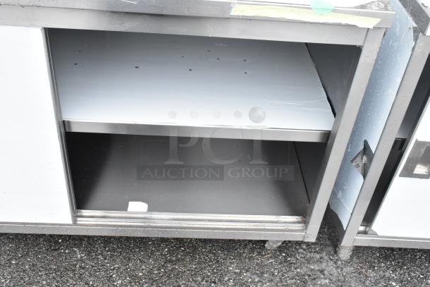 Brand new Steelton 522EBT3060D 30" x 60" stainless steel table with sliding doors, midshelf. Scratch and dent condition.
