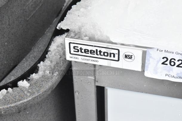 BRAND NEW Steelton 522EBT3060D stainless steel table, 30"x60", enclosed base, sliding doors, midshelf; minor scratches.