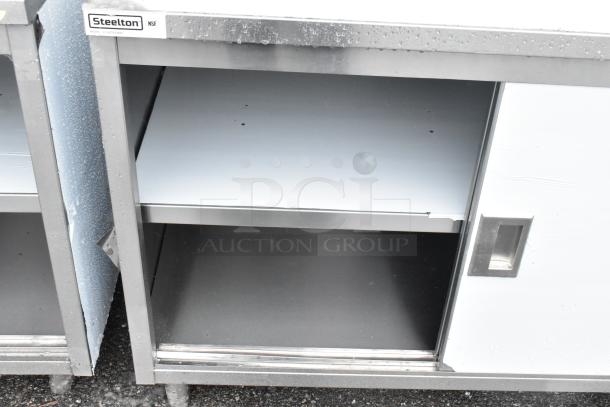 Steelton 522EBTB3048D 30" x 48" stainless steel table with sliding doors, midshelf, 6" backsplash, brand new, slight scratches.