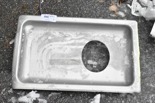 Brand new scratch and dent stainless steel meat grinder tray with a central circular cutout. Some wear visible.