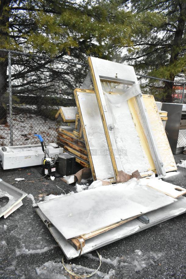 Walk-in box with compressor, LCA672AB 115V 1-phase evaporator fan. Condition: used, with visible wear. Snow-covered panels displayed.