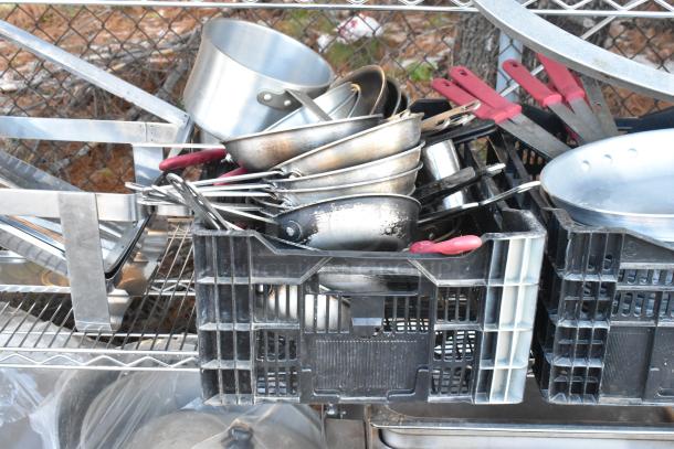 Chrome finish 4-tier wire shelving unit with chafer, mixing bowls, whisk attachments, and skillets. Buyer must dismantle.