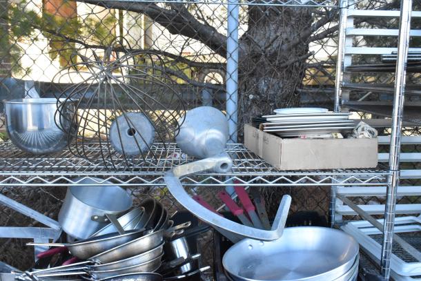 Chrome finish 4-tier wire shelving unit with chafer, mixing bowls, whisk attachments, skillets. Buyer dismantles.