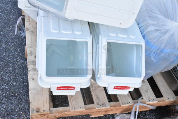 Four Rubbermaid white poly ingredient bins on a pallet, featuring red labels. Bins appear in used condition.