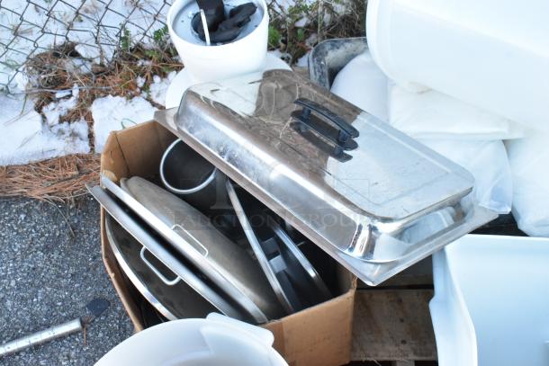 Assorted kitchen items including stainless steel chafer lid and poly bins, showing signs of use. Auction lot of 11 items.