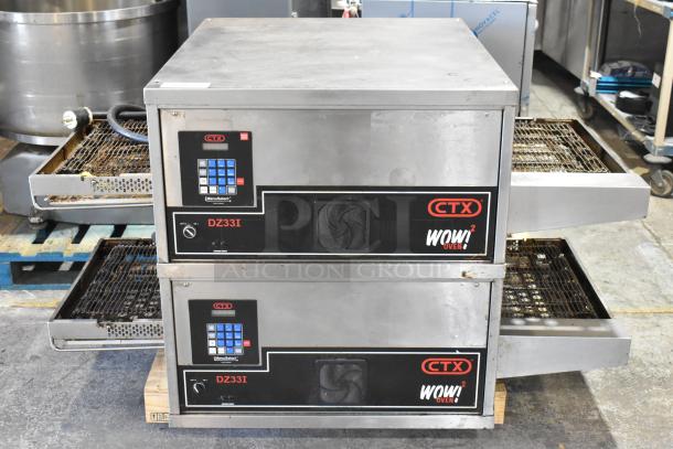 Two Middleby Marshall CTX DZ33I stainless steel conveyor pizza ovens on casters, electric powered, 208V, 3/1 phase.