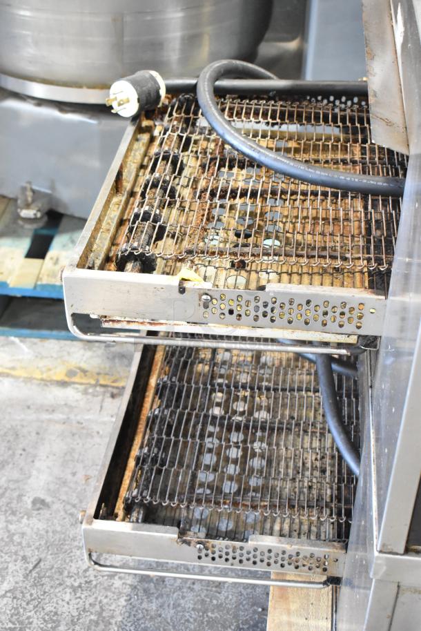 Middleby Marshall CTX DZ33I stainless steel conveyor pizza oven on commercial casters, showing power cable and trays.