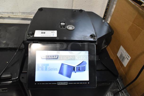 Hobart HTi-LH metal countertop scale with label printer. Missing plate, no power cord. Tested and working. Model shown on display.