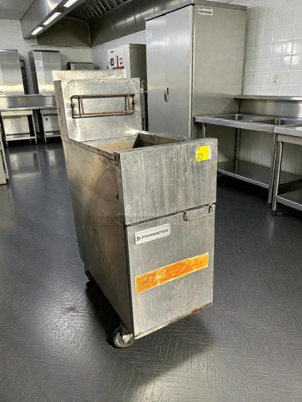 Frymaster ESG35T 35lb stainless steel gas fryer in used condition, tested and working. Features branding label and wheels.