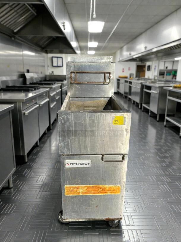Frymaster ESG35T 35lb stainless steel gas fryer, tested and working, with visible label, moderate wear, in kitchen setting.