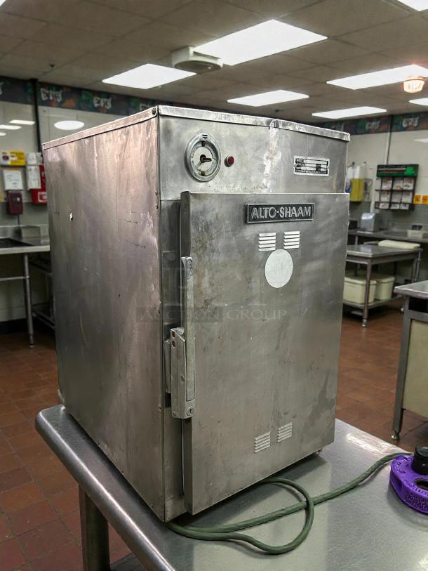 Alto-Shaam 500-S mobile holding cabinet, stainless steel, 6-pan capacity, showing brand logo, thermostat, and visible wear.