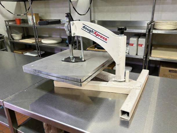 DoughXpress TXM-15CP manual meat press in great condition on stainless steel counter. Features robust handle, tested and working.