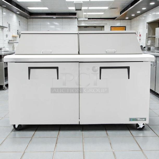 True TSSU-60-24M-B-ST-HC Mega Top 60" Sandwich Prep Table, excellent condition, with refrigerated base and tested working.