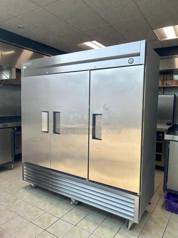 True TS-72-HC three-section reach-in refrigerator with left/right hinge solid doors, stainless steel, tested working condition.