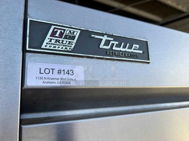 True TS-72-HC refrigerator with three solid doors, left/right hinge. Great condition, lot #143 label visible.