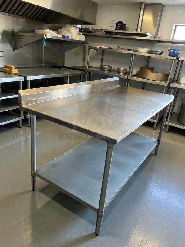Eagle Group stainless steel worktop table, model T3084SB-X, with 2" backsplash and galvanized bottom shelf in great condition.