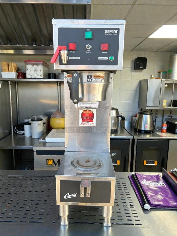 Curtis GEM-120A-10 coffee brewer, 1-gallon capacity, great condition. Features brew selector, tested and functional.