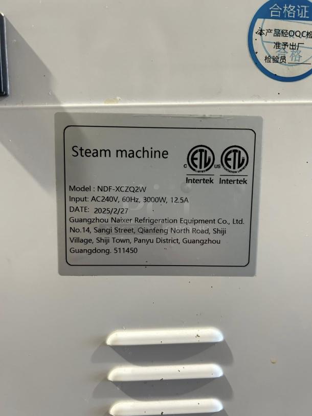 Guangzhou Naixer NDF-XCZQ2W milk steamer, 240v, 3000W. Label indicates model, power specs, and manufacturer details. Tested.