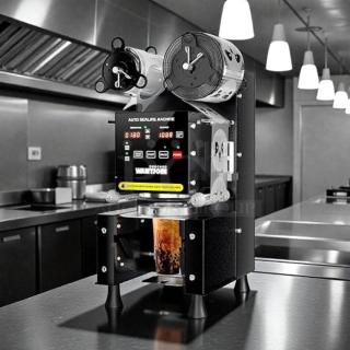 WantJoin Cup Sealing Machine WZ-95B, 110-120V, tested and working, in a commercial kitchen setting.