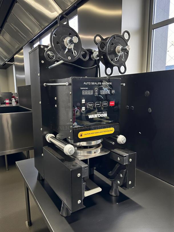 WANTJOIN WZ-95B cup sealing machine, B088FFQSST, tested and working, with digital display and caution label.
