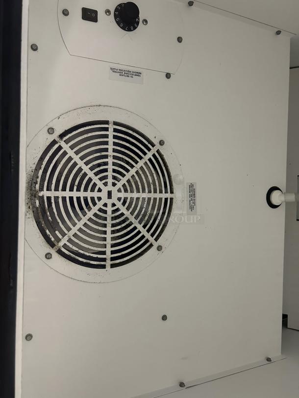 True GDM-23-HC~TSL01 merchandiser interior, white with ventilation grille and control panel, excellent condition.