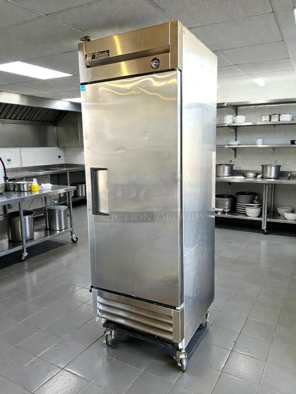 True TS-23F-HC 23 Cu.Ft commercial freezer with solid stainless door, tested and working. Features True branding, on wheels.