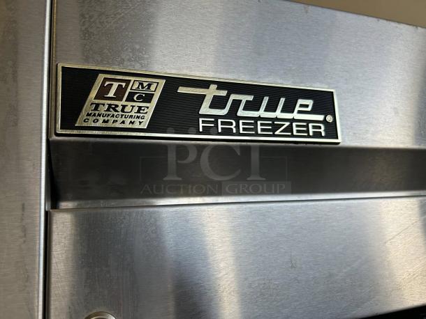 True TS-23F-HC 23 Cu.Ft commercial freezer, stainless steel door, tested and working, True Manufacturing Company logo visible.