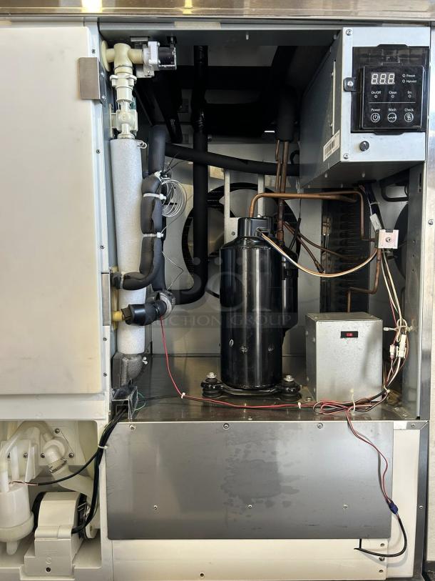 Blue Air BLMI-850A 850lb ice machine interior view, showcasing components; tested, in working condition. Digital display visible.