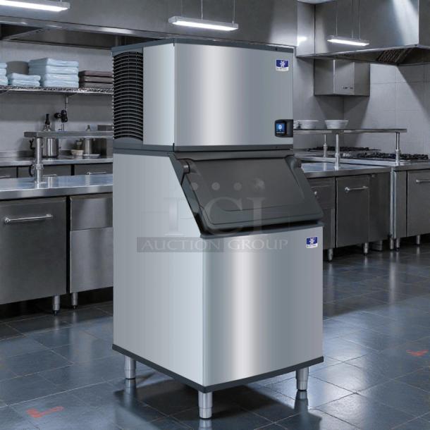 Manitowoc SY0854A air-cooled ice maker in excellent condition, tested and working, in a commercial kitchen setting.